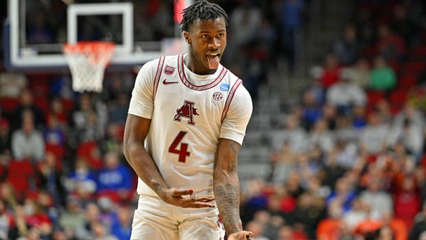Hogs' Davonte Davis celebrates a three-pointer in NCAA Tournament win over Illinois.
